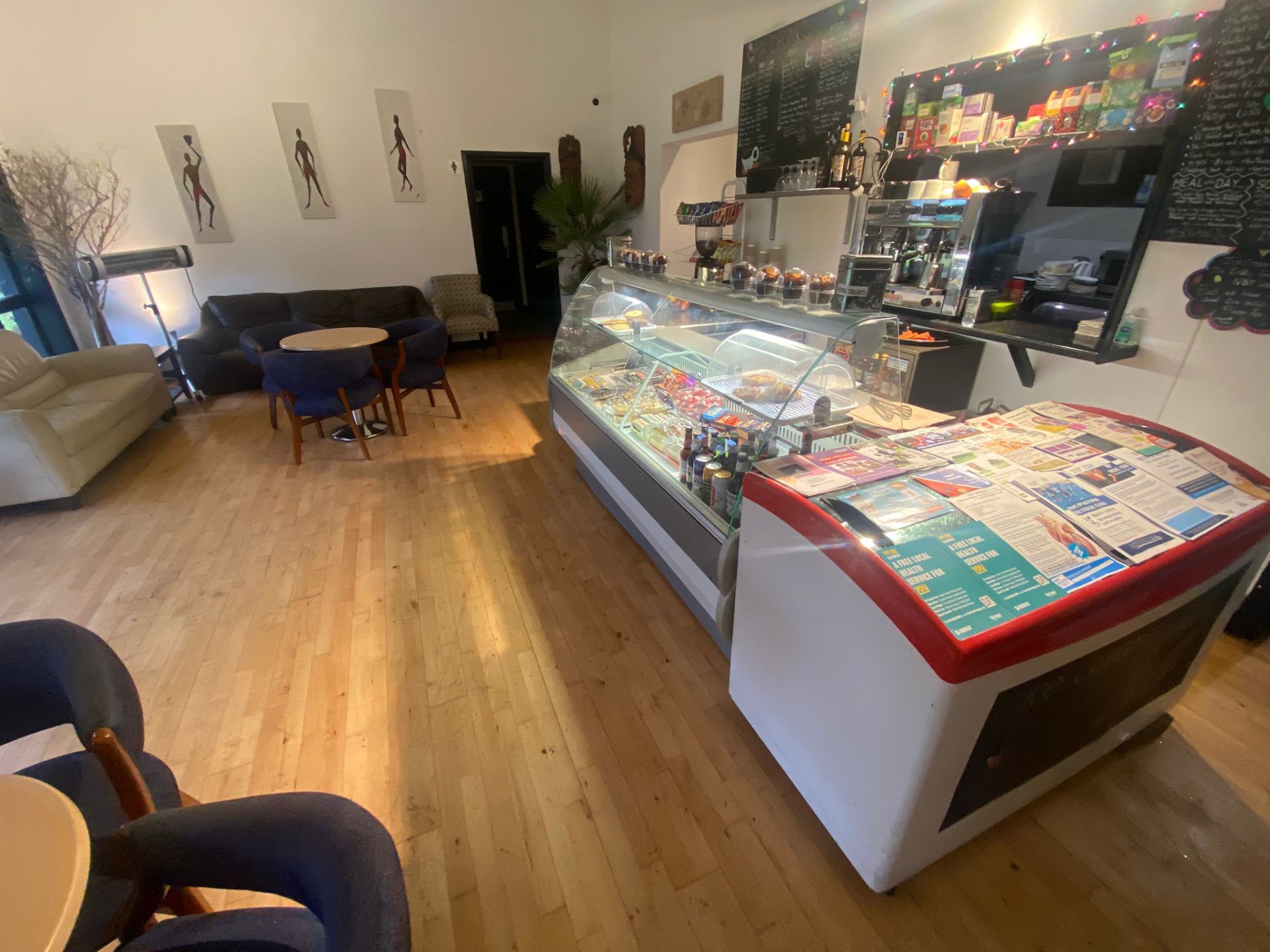 Inside the Bruce Castle Park café, with seating and the counter