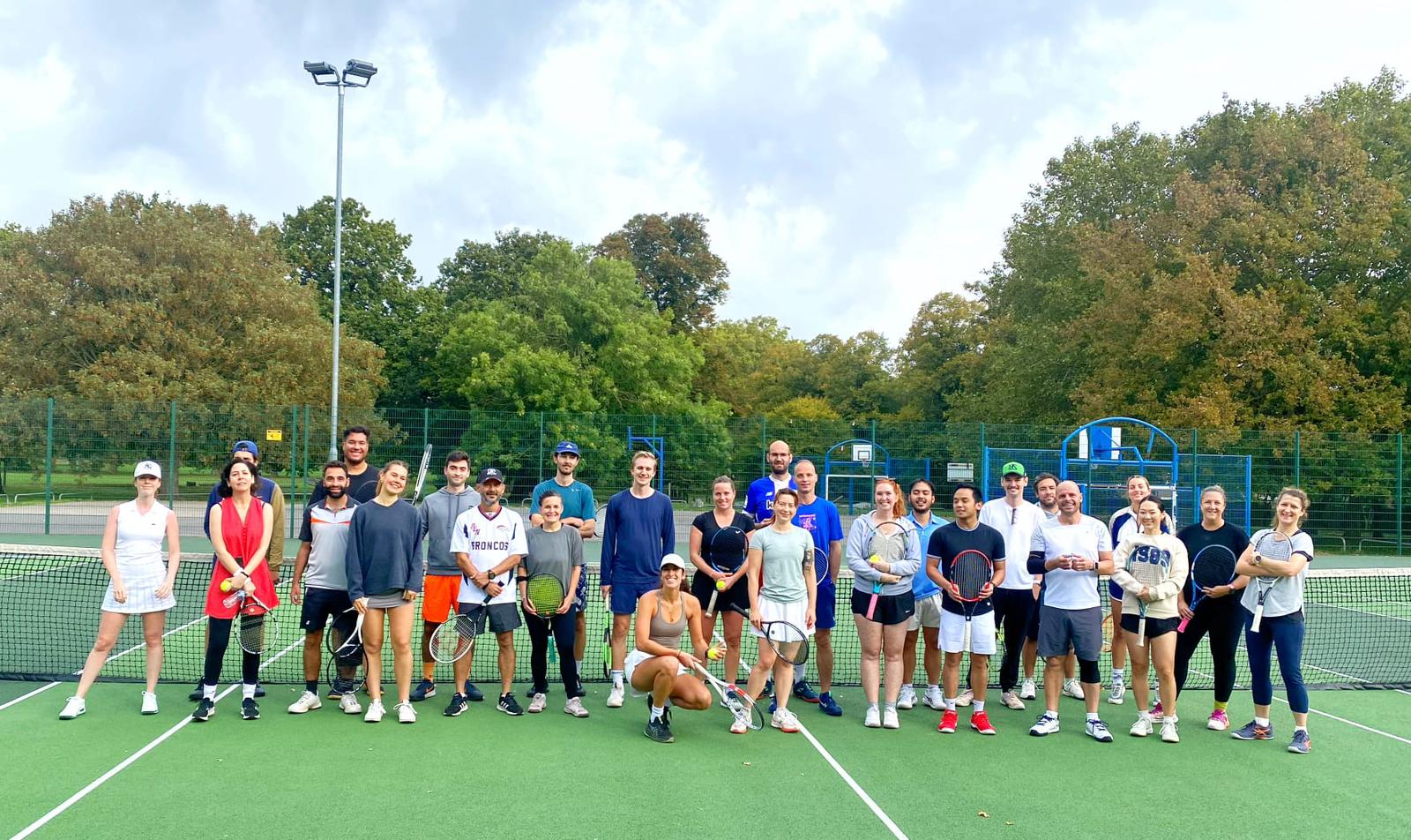 Group of Pavilion players with rackets on the courts